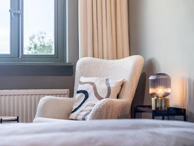 Ein Bett oder Betten in einem Zimmer der Unterkunft Ferienhaussiedlung Strandperlen Küstenhof 4b (Typ IX)