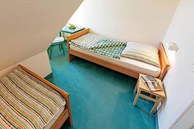 Ein Bett oder Betten in einem Zimmer der Unterkunft Ferienhaussiedlung Strandperlen Küstenhof 1b (Typ V)