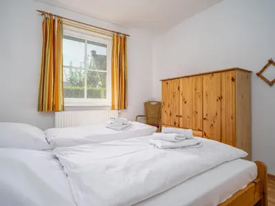 Ein Bett oder Betten in einem Zimmer der Unterkunft Haus MEERESRAUSCHEN Whg. MR-1