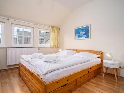 Ein Bett oder Betten in einem Zimmer der Unterkunft Haus MEERESRAUSCHEN Whg. MR-2