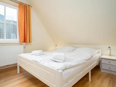 Ein Bett oder Betten in einem Zimmer der Unterkunft Haus MEERESRAUSCHEN Whg. MR-2