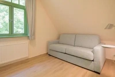 Ein Sitzbereich in der Unterkunft Ferienhaussiedlung Strandperlen Buchenhof 6a (Typ III)