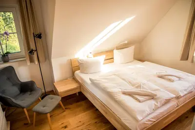 Ein Bett oder Betten in einem Zimmer der Unterkunft ILEX Appartements
