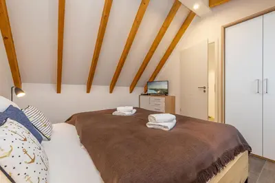 Ein Bett oder Betten in einem Zimmer der Unterkunft Suite Strandluft