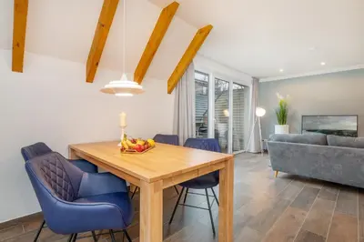 Ein Sitzbereich in der Unterkunft Suite Strandluft