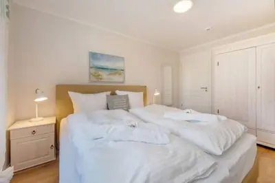 Ein Bett oder Betten in einem Zimmer der Unterkunft Suite Windkieker