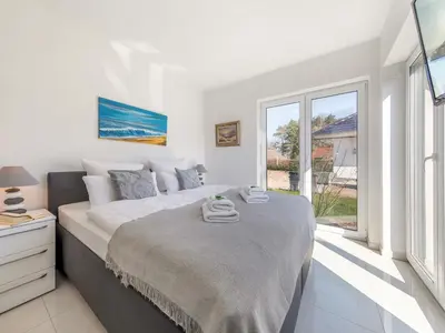 Ein Bett oder Betten in einem Zimmer der Unterkunft Suite Windsegler