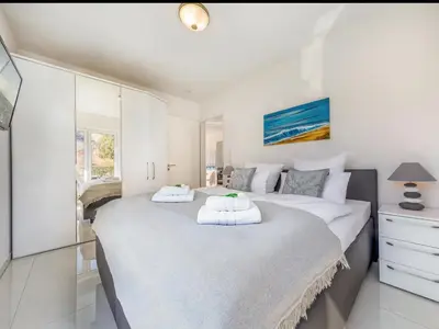 Ein Bett oder Betten in einem Zimmer der Unterkunft Suite Windsegler