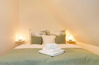 Ein Bett oder Betten in einem Zimmer der Unterkunft Lütte Hanna