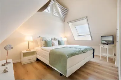 Ein Bett oder Betten in einem Zimmer der Unterkunft Lütte Hanna