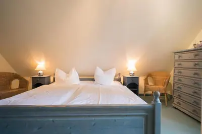 Ein Bett oder Betten in einem Zimmer der Unterkunft Ferienhaussiedlung Strandperlen Sanddornhof 5a (Typ IV)