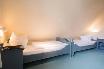 Ein Bett oder Betten in einem Zimmer der Unterkunft Ferienhaussiedlung Strandperlen Sanddornhof 5a (Typ IV)