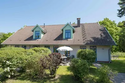 Ein Garten an der Unterkunft Ferienhaussiedlung Strandperlen Küstenhof 3c (Typ V)