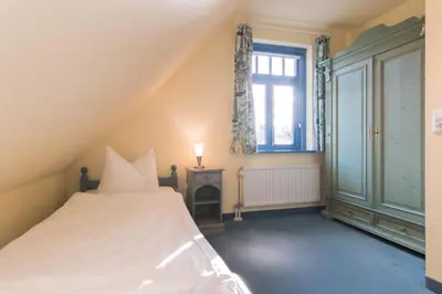 Ein Bett oder Betten in einem Zimmer der Unterkunft Ferienhaussiedlung Strandperlen Küstenhof 3d (Typ IV)