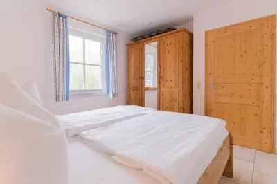 Ein Bett oder Betten in einem Zimmer der Unterkunft Haus WINDFLÜCHTER Whg. LF 5.1