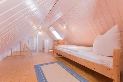 Ein Bett oder Betten in einem Zimmer der Unterkunft Haus WINDFLÜCHTER Whg. LF 5.2