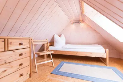 Ein Bett oder Betten in einem Zimmer der Unterkunft Haus WINDFLÜCHTER Whg. LF 5.2