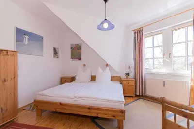 Ein Bett oder Betten in einem Zimmer der Unterkunft KOJE