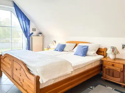 Ein Bett oder Betten in einem Zimmer der Unterkunft Windwatt 4