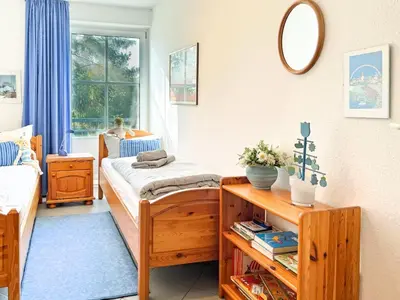 Ein Bett oder Betten in einem Zimmer der Unterkunft Windwatt 4