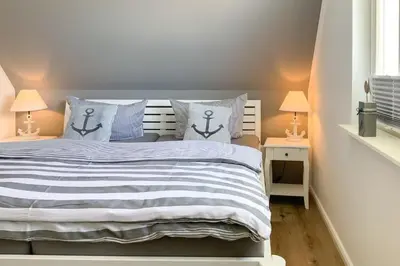 Ein Bett oder Betten in einem Zimmer der Unterkunft Dat Kroeger Hus