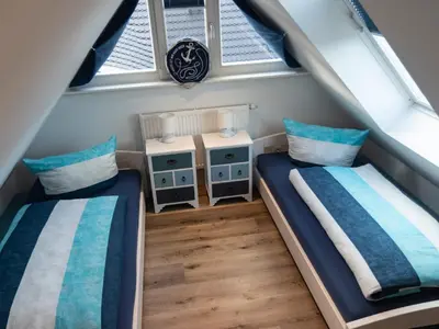 Ein Bett oder Betten in einem Zimmer der Unterkunft Dat Kroeger Hus
