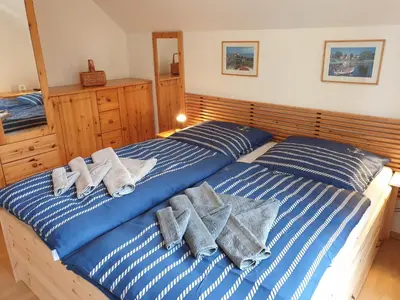 Ein Bett oder Betten in einem Zimmer der Unterkunft Möwenblick Nr 3 - für die schönste Zeit des Jahres -