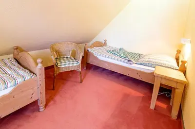 Ein Bett oder Betten in einem Zimmer der Unterkunft Ferienhaussiedlung Strandperlen Buchenhof 4a (Typ IV)
