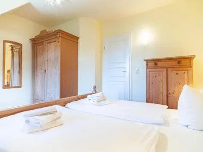 Ein Bett oder Betten in einem Zimmer der Unterkunft Ferienhaussiedlung Strandperlen Buchenhof 4b (Typ V)