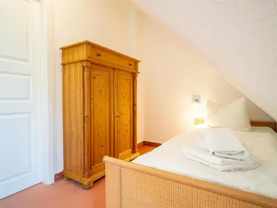 Ein Bett oder Betten in einem Zimmer der Unterkunft Ferienhaussiedlung Strandperlen Buchenhof 4b (Typ V)