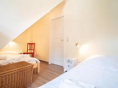 Ein Bett oder Betten in einem Zimmer der Unterkunft Ferienhaussiedlung Strandperlen Buchenhof 4c (Typ V)