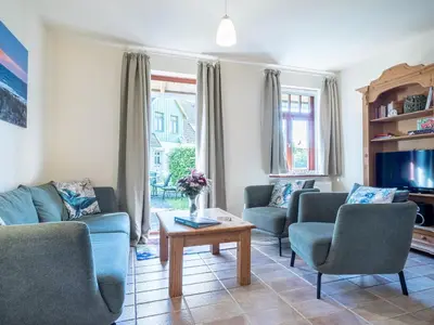 Ein Sitzbereich in der Unterkunft Ferienhaussiedlung Strandperlen Buchenhof 4c (Typ V)