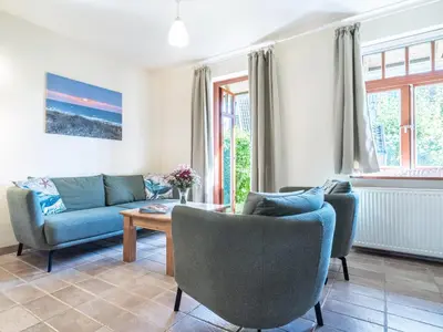 Ein Sitzbereich in der Unterkunft Ferienhaussiedlung Strandperlen Buchenhof 4c (Typ V)
