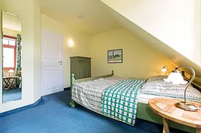 Ein Bett oder Betten in einem Zimmer der Unterkunft Ferienhaussiedlung Strandperlen Buchenhof 5b (Typ V)