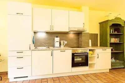 Küche/Küchenzeile in der Unterkunft Ferienhaussiedlung Strandperlen Buchenhof 5b (Typ V)