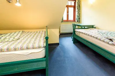 Ein Bett oder Betten in einem Zimmer der Unterkunft Ferienhaussiedlung Strandperlen Buchenhof 5b (Typ V)