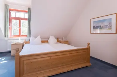 Ein Bett oder Betten in einem Zimmer der Unterkunft Ferienhaussiedlung Strandperlen Buchenhof 5c (Typ V)