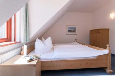 Ein Bett oder Betten in einem Zimmer der Unterkunft Ferienhaussiedlung Strandperlen Buchenhof 5c (Typ V)