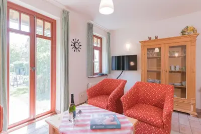 Ein Sitzbereich in der Unterkunft Ferienhaussiedlung Strandperlen Buchenhof 5c (Typ V)