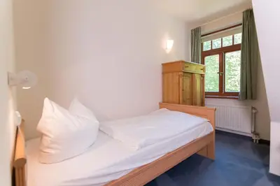 Ein Bett oder Betten in einem Zimmer der Unterkunft Ferienhaussiedlung Strandperlen Buchenhof 5c (Typ V)