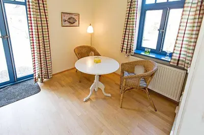 Ein Sitzbereich in der Unterkunft Ferienhaussiedlung Strandperlen Weidenhof 5a (Typ VII)