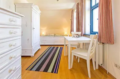 Ein Bett oder Betten in einem Zimmer der Unterkunft Ferienhaussiedlung Strandperlen Weidenhof 5a (Typ VII)