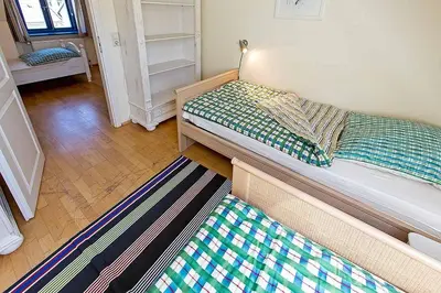 Ein Bett oder Betten in einem Zimmer der Unterkunft Ferienhaussiedlung Strandperlen Weidenhof 5a (Typ VII)