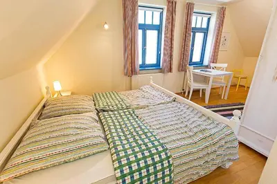 Ein Bett oder Betten in einem Zimmer der Unterkunft Ferienhaussiedlung Strandperlen Weidenhof 5a (Typ VII)