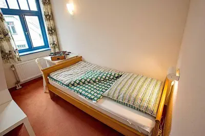 Ein Bett oder Betten in einem Zimmer der Unterkunft Ferienhaussiedlung Strandperlen Weidenhof 8b (Typ V)