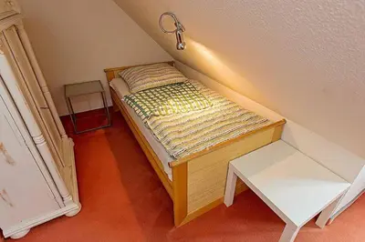Ein Bett oder Betten in einem Zimmer der Unterkunft Ferienhaussiedlung Strandperlen Weidenhof 8b (Typ V)