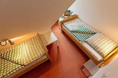 Ein Bett oder Betten in einem Zimmer der Unterkunft Ferienhaussiedlung Strandperlen Weidenhof 8b (Typ V)
