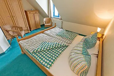 Ein Bett oder Betten in einem Zimmer der Unterkunft Ferienhaussiedlung Strandperlen Weidenhof 8c (Typ V)