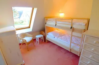 Ein Bett oder Betten in einem Zimmer der Unterkunft Ferienhaussiedlung Strandperlen Weidenhof 3a (Typ VIII)
