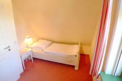 Ein Bett oder Betten in einem Zimmer der Unterkunft Ferienhaussiedlung Strandperlen Weidenhof 3a (Typ VIII)